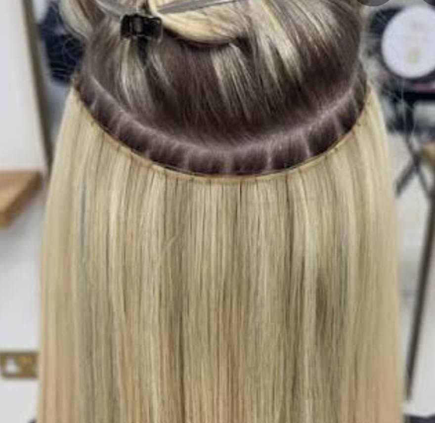 Close-up of a hand-tied weft extension installed and color-matched at Salon East Naples