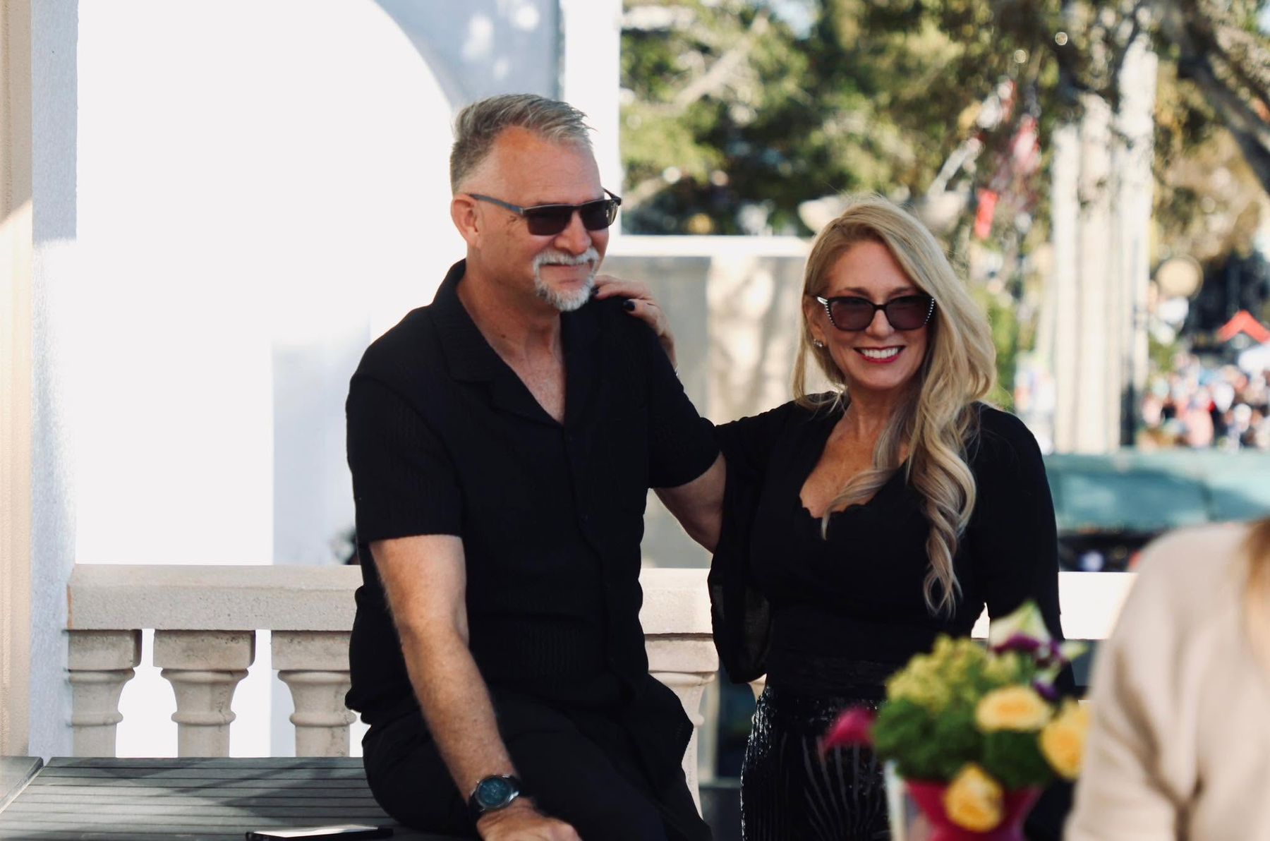 JoAnn and Paul Gustafson, owners of Salon East, on the salon balcony above 5th Avenue South in Naples